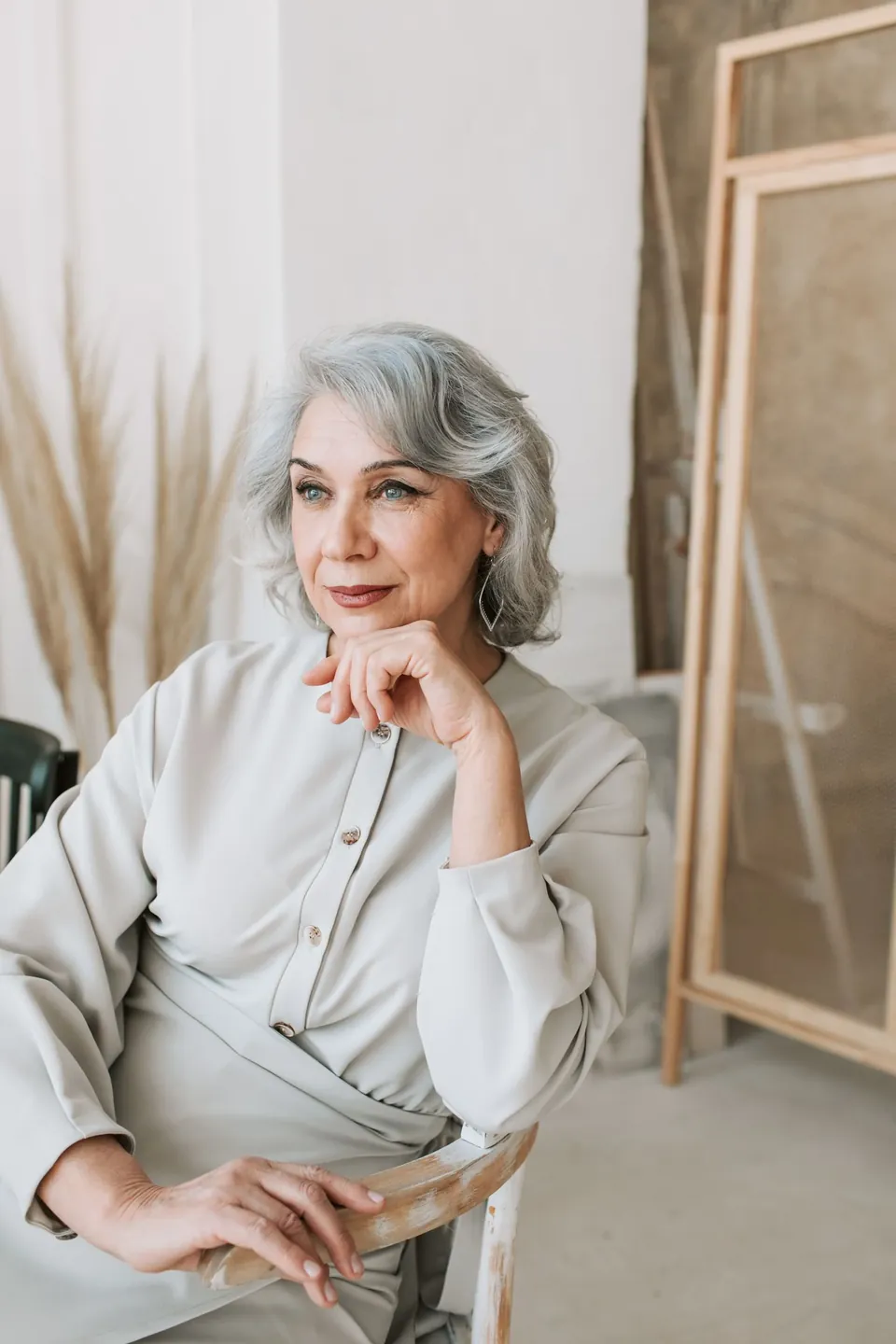 Licensed editorial portrait of a woman seated in natural light